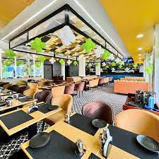 The interior of Thali & More restaurant, showing the modern, clean dining area with comfortable seating and contemporary decor.